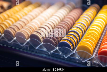 delicious French macaroons in a row in an assortment Stock Photo
