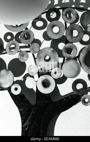 A close-up shot of a metal tree sculpture, showcasing a modern and artistic design. Stock Photo