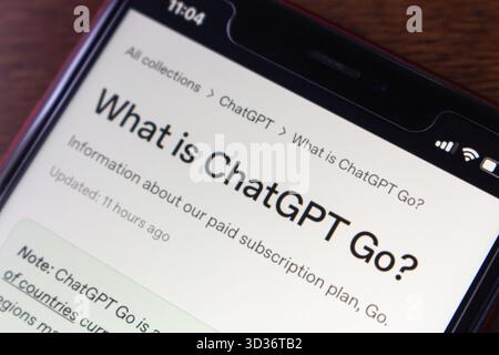 Quito, ECUADOR - Nov 4 2025 : Angled close-up of a smartphone screen displaying information about the ChatGPT Go service by OpenAI. Stock Photo