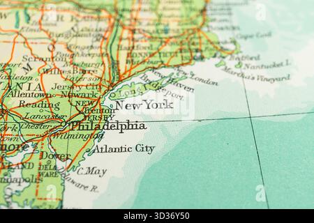 Close-up vintage road map section highlighting northeastern US, with major cities like New York and Philadelphia, Chesapeake Bay, roads, forested area Stock Photo