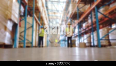 Logistics, engineers and goods in warehouse, blurry and inventory of supply chain, group or delivery. Stock, distribution and people with merchandise Stock Photo