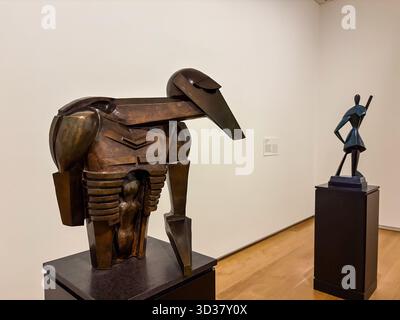 Two abstract bronze sculptures displayed on pedestals in a minimalist gallery space at the Auckland Art Gallery Toi o Tāmaki in Auckland, New Zealand. Stock Photo