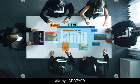 Business professionals collaborate in virtual reality, focused on coding and programming in various languages, showcasing a modern approach to Stock Photo