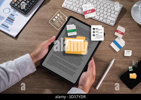 man manage digital documents spreadsheet Data Information file copies and optimize workflow Backup online document files Stock Photo