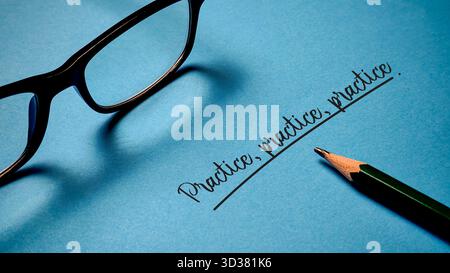 Practice, practice, practice concept: Eyeglasses and pencil on blue background highlighting dedication, repetition, and continuous improvement for suc Stock Photo