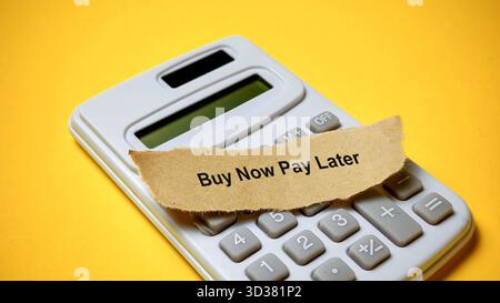 Buy Now Pay Later (BNPL) Financial Technology Concept on Calculator Stock Photo