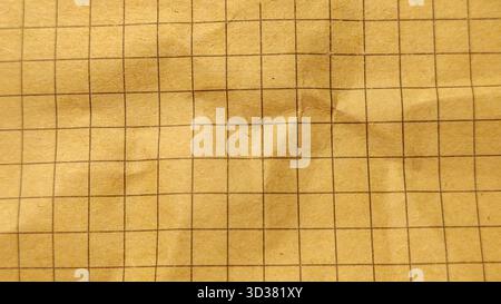 Wrinkled Old Vintage Brown Graph Grid Paper Texture Full Frame Background for Retro Design Stock Photo