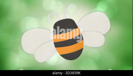 Floating cartoon bee gliding over green gradient, featuring white wings orange stripes and antennae Stock Photo