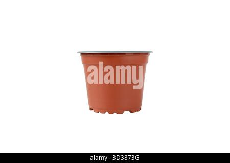 Empty brown plastic flower pot isolated on white background. Ideal for gardening themes, plant containers, home decor, product design, retail packagin Stock Photo