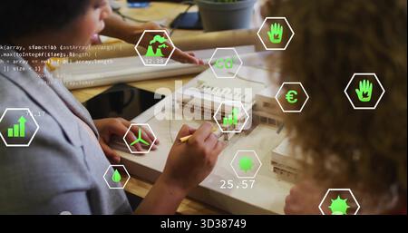 Group professionals sketching and measuring scale model in design studio, with holographic overlays Stock Photo