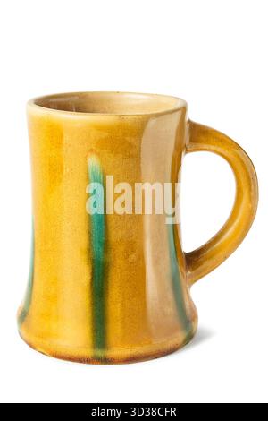 Yellow ceramic craft mug isolated on white bakground Stock Photo