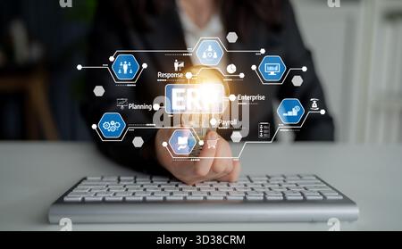 A business professional interacts with digital tools showcasing ERP solutions, highlighting key aspects of efficient planning and modern enterprise Stock Photo