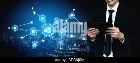A business professional interacts with a digital tablet, analyzing key performance indicators in a modern urban setting, highlighting data-driven Stock Photo