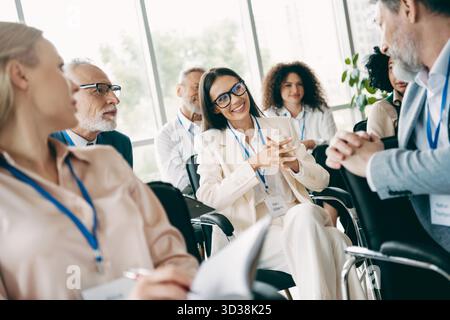 Diverse Team Engaging in Collaborative Discussion During a Corporate Training Session in a Contemporary Office Setting Stock Photo