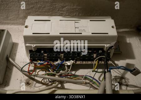 Open electrical control box with colorful wires and circuits for maintenance or repair work. Stock Photo
