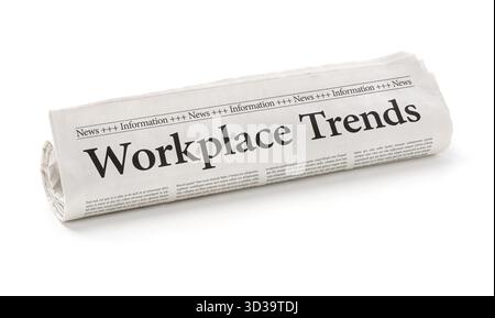 Rolled newspaper with the headline Workplace Trends Stock Photo