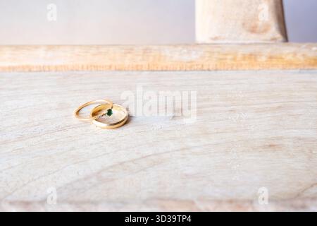 Two engagement rings on natural wood Stock Photo