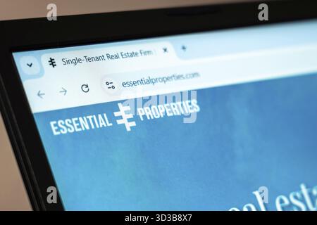 New York, USA - January 07, 2025: Essential Properties website displayed on computer screen showcasing real estate investments and property management Stock Photo