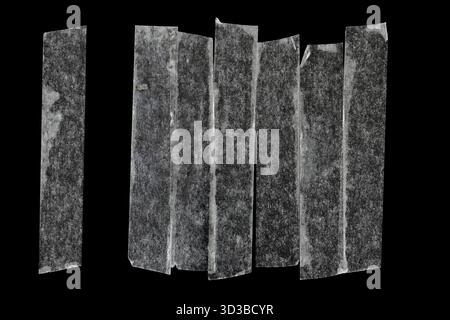 Matte plastic adhesive tape isolated on black background. Line addition of the tape on background Stock Photo
