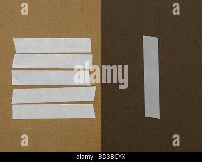 White plastic adhesive tape on dark and bright grunge beige background with copy space. Line addition of the tape on background Stock Photo