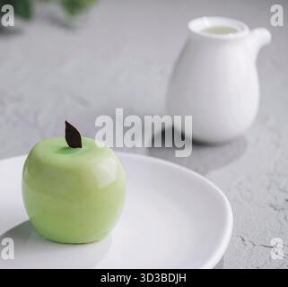 Food, Green apple shaped mousse cake on plate Stock Photo