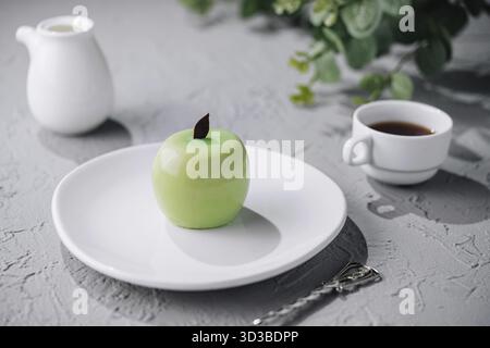 Food, Apple shaped mousse cake and tea Stock Photo