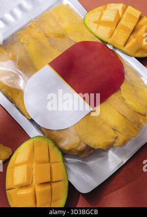 Food, Pack of dried mango slices and raw mango Stock Photo