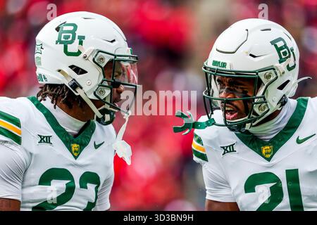 Baylor Safeties CAMEREN JENKINS (23) and BO ONU (21) celebrate after making a tackle during a college football game. Stock Photo