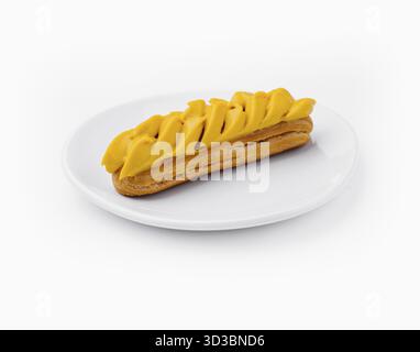 Food, Eclair with Mango Cream on White Plate Stock Photo
