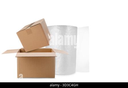 Cardboard boxes and bubble wrap roll on white background Stock Photo