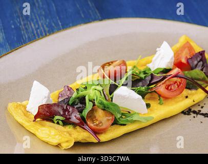 Food, Omelette with cherry tomatoes and goat cheese Stock Photo