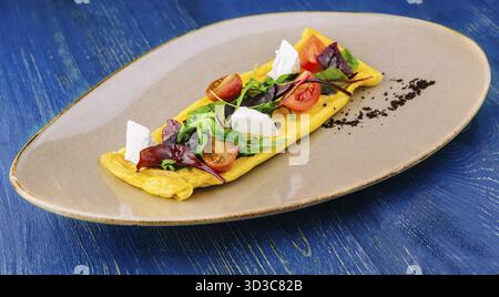 Food, Omelette with cherry tomatoes and goat cheese Stock Photo