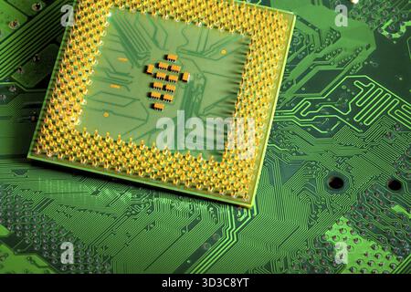 Macro Close up of microchips and pins on Main CPU PC processor circuit board Stock Photo