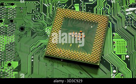 Macro Close up of microchips and pins on Main CPU PC processor circuit board Stock Photo