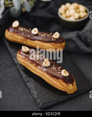 Food, French eclairs with chocolate and hazelnuts Stock Photo