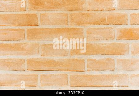 Orange brick wall background texture with rectangular pattern and grunge look. Stock Photo