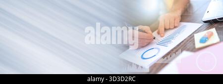 Man working on financial graphs in office, double exposure, light effect; panoramic banner Stock Photo