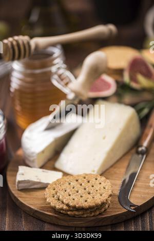 Cheese crackers on board, festive food Stock Photo