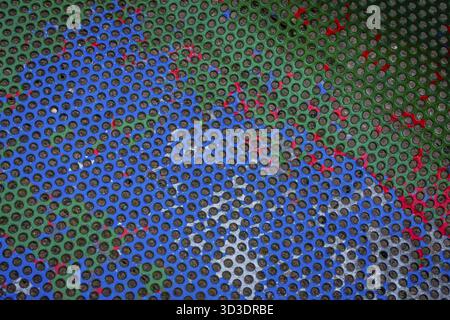 Colourful circle patterns on the painted metal bench Stock Photo