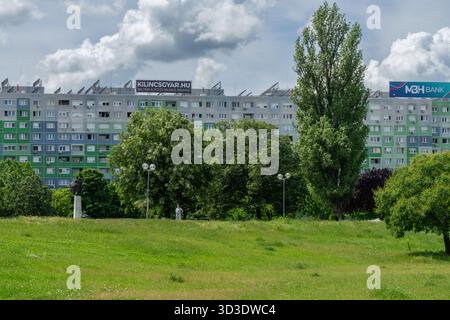 Urban park at Florian Square in Óbuda, Budapest, with large panel housing blocks behind the green open space. Stock Photo