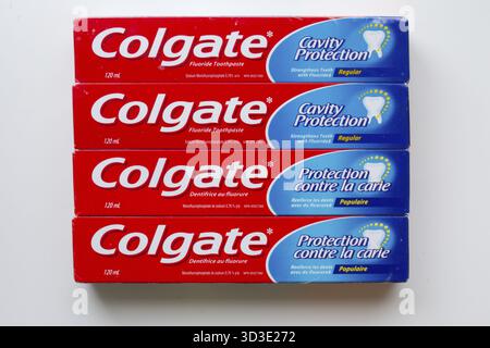 Calgary, Alberta, Canada. Oct 2, 2024. Multiple boxes of Colgate toothpaste arranged against a white background Stock Photo