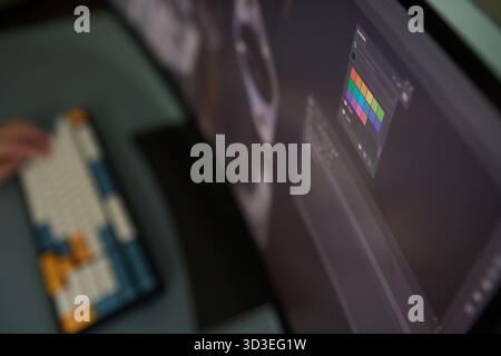 Designer Editing Photo On Computer In Office Stock Photo