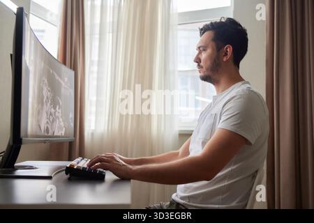 Designer Editing Photo On Computer In Office Stock Photo