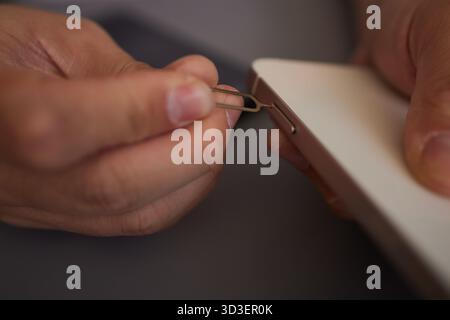 SIM card replacement in the phone Stock Photo