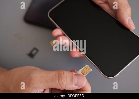SIM card replacement in the phone Stock Photo