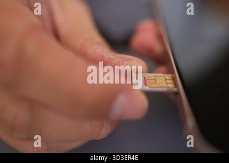 SIM card replacement in the phone Stock Photo