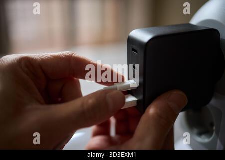 Charging devices that feature multiple ports and connectors for versatile connectivity Stock Photo