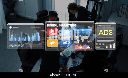 A diverse group of business professionals engages in collaborative digital marketing discussions with advanced technology and vibrant data Stock Photo