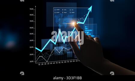 A dynamic visual showing a hand interacting with a high-tech digital graph that displays an upward trajectory, symbolizing financial growth and data Stock Photo