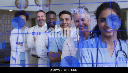 Lining up six medical staff in hospital hallway, with scrubs, coats, stethoscopes, digital overlay Stock Photo